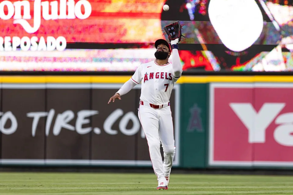 Jo Adell #7 of the Los Angeles Angels catches a fly ball during an MLB game against the Texas Rangers on May 23, 2026 at Angel Stadium in Anaheim, California.