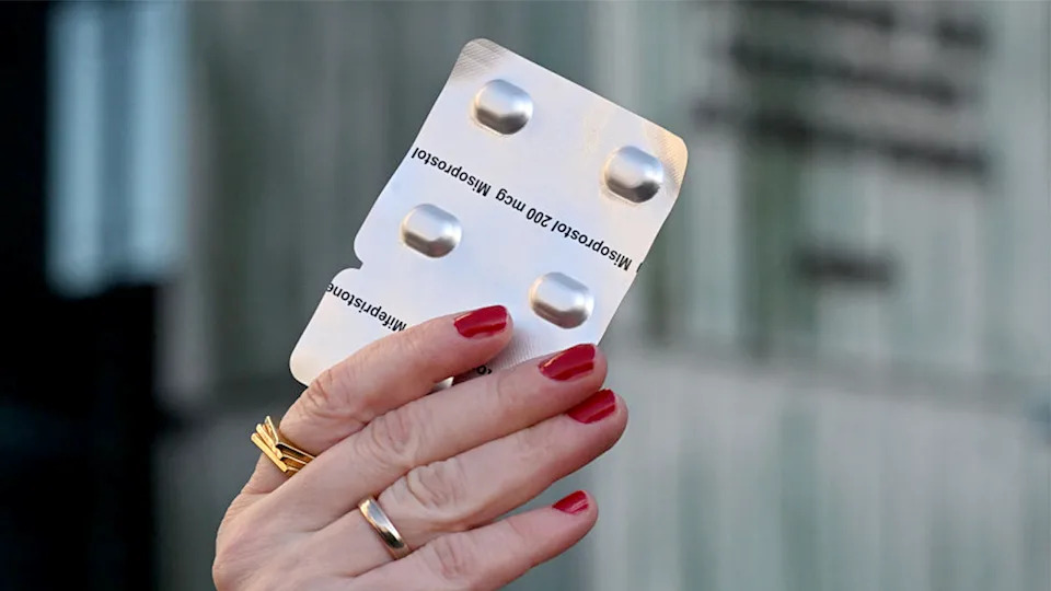 Packet of Misoprostol abortion pills on a white surface
