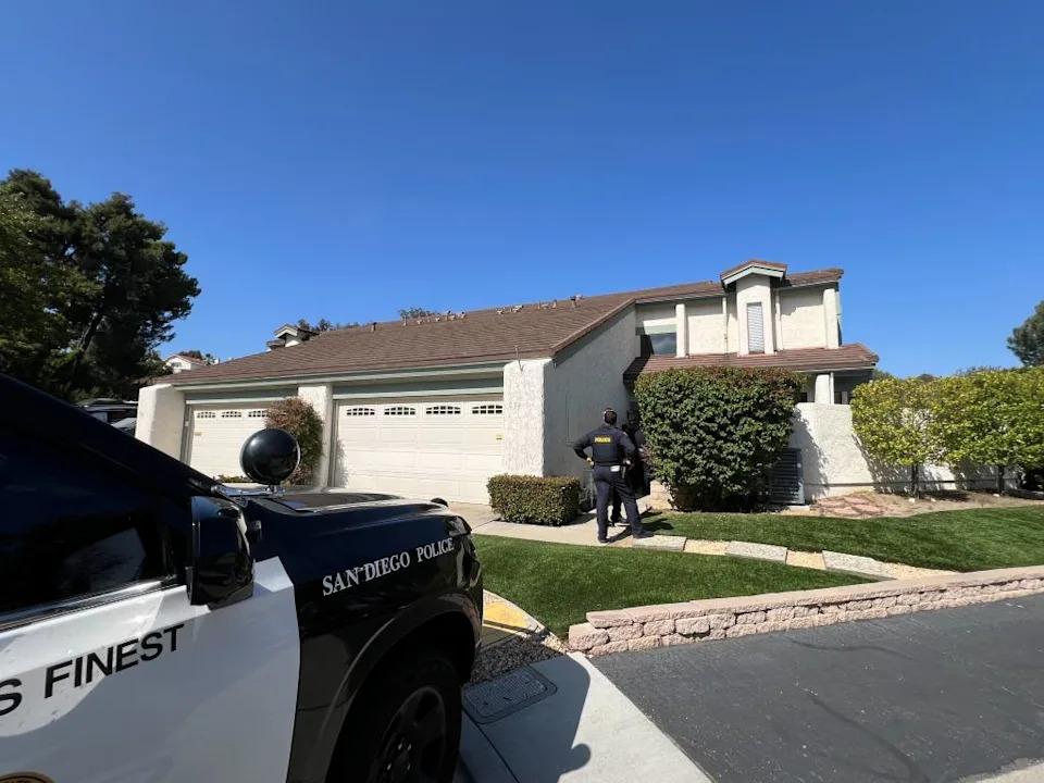 Police were seen carrying small brown paper bags, apparently containing evidence collected inside the property. CA Post