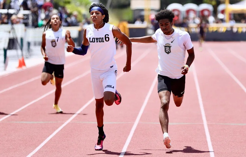 Loyola's Ejam Yohannes beats Servite's Jaelen Hunter by 11 hundredths of a second in the 400-meter dash.