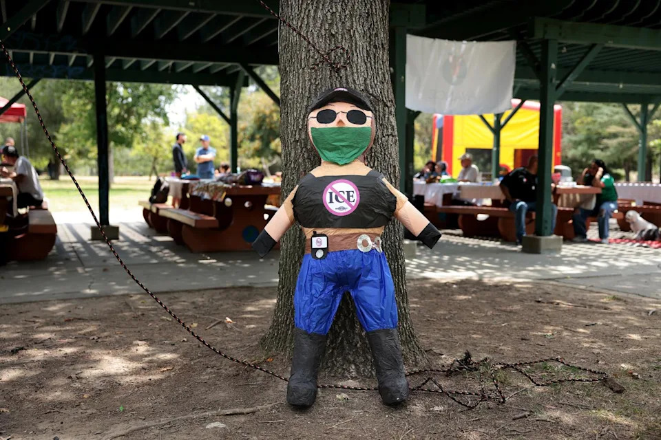 A piñata rests against a tree at Avance Democratic Club's politics and tacos event