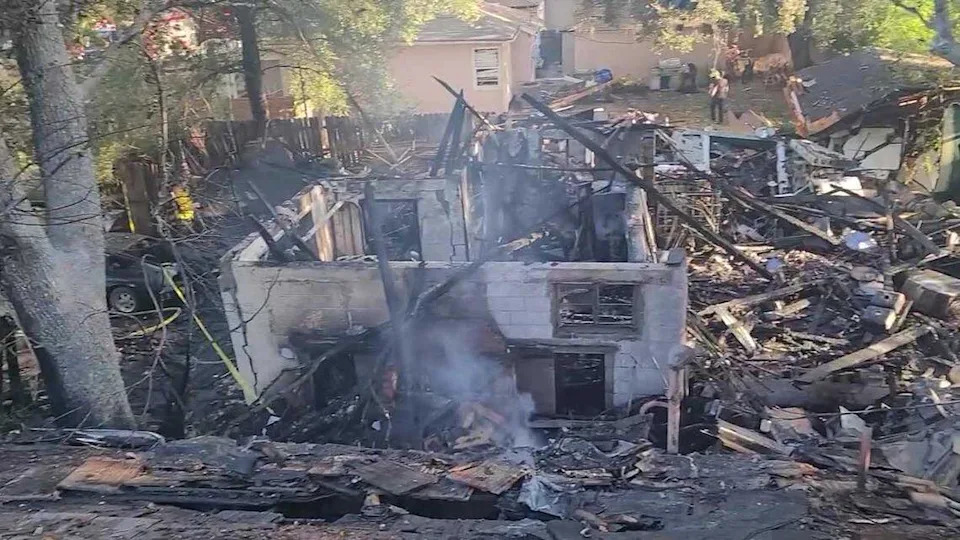 Remains of Karl Lysinger’s home smolder in August after the explosion leveled the structure, killing Lysinger. The home straddled two parcels, one of which was sold in a tax auction in 2025 for $151,266.65.