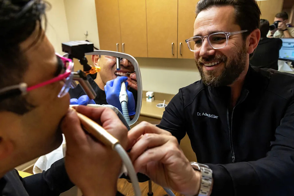 Dr. Brian Baliwas and Dr. Adam Miller provide a hands-on demonstration at 450 Aesthetics Dental Group in San Francisco. (Chris Partin/Special to SFGATE)