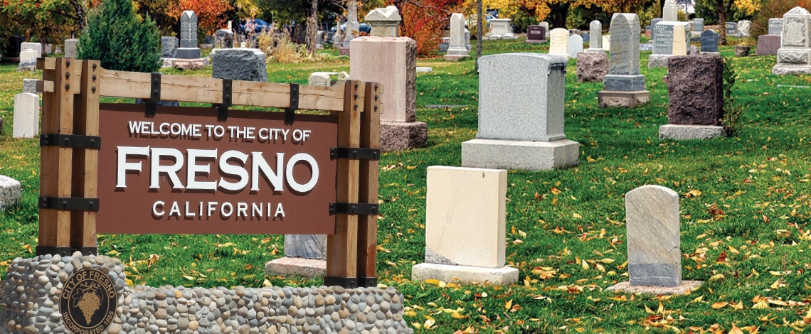 graveyard with a fresno monument sign