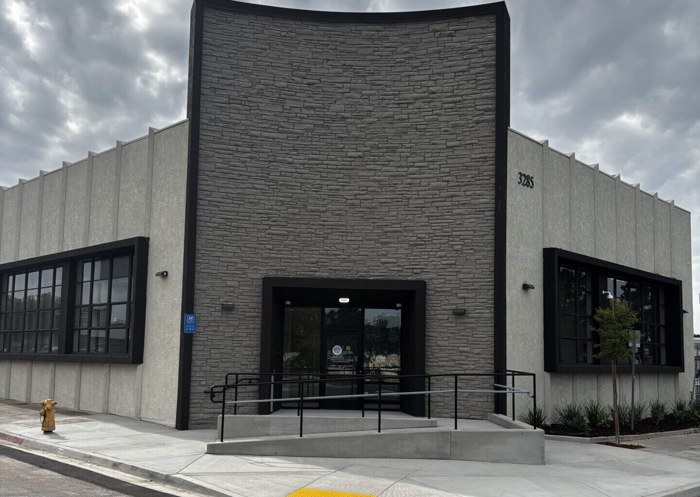 Front of building with stacked stone
