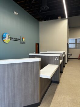 lobby with wooden desk and blue wall