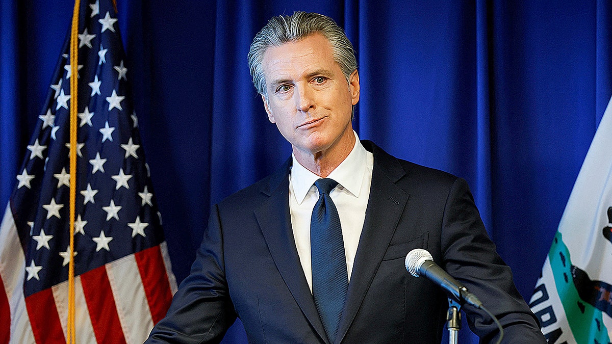 California Gov. Gavin Newsom speaking at a news conference in Sacramento
