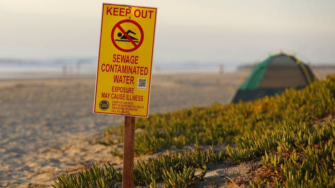 San Diego CA - December 22: A water contamination sign warns beach goers about high bacteria in the water in Imperial Beach on Thursday, December 22, 2022.