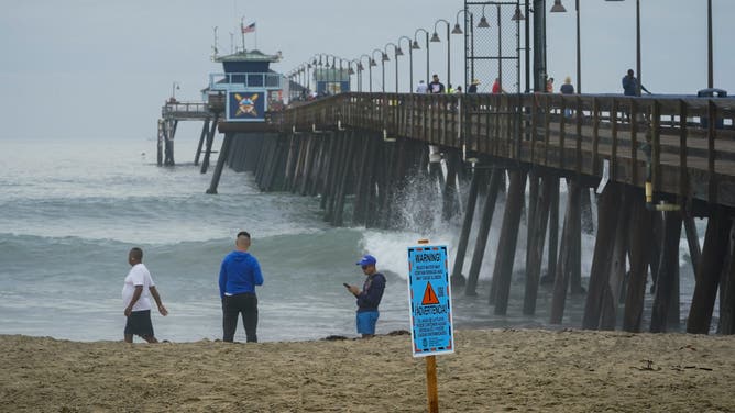Imperial Beach, CA - September 10: On Saturday posted warning signs at Imperial Beach from County of San Diego Environmental Health and Quality warn the public of the possibility of sewage in the beach water.