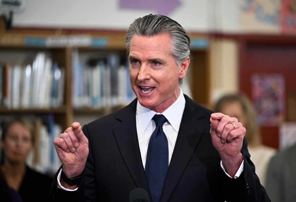 Governor Gavin Newsom speaking at a press conference in San Lorenzo, California.