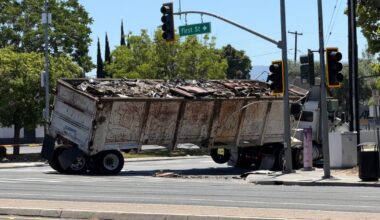 Disabled semi truck in San Jose teeters next to power pole; power shut off to thousands