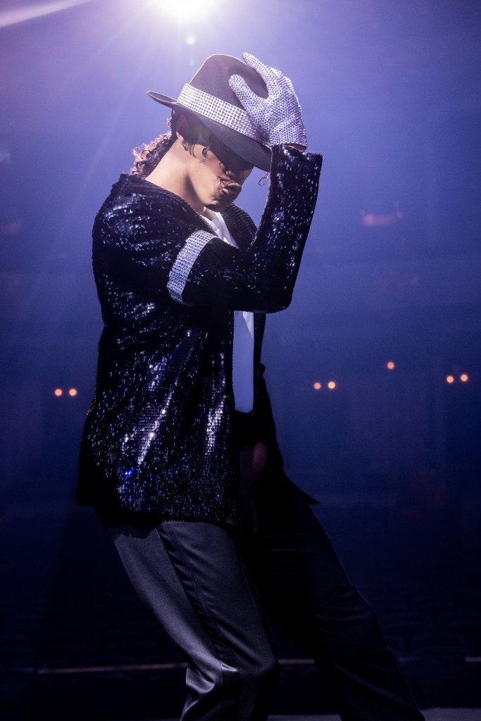 An actor poses as Michael Jackson with the shiny glove