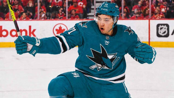 An image of Jason Robertson, wearing a teal San Jose Sharks jersey with number 71, celebrating a goal on the ice. This photo visually depicts the blockbuster trade rumor scenario.
