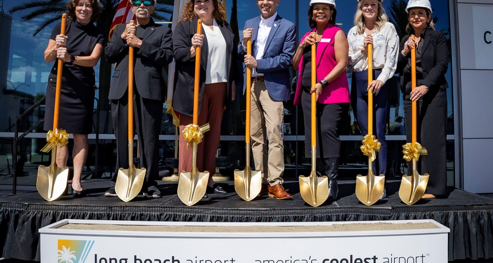 A line of people with golden shovels