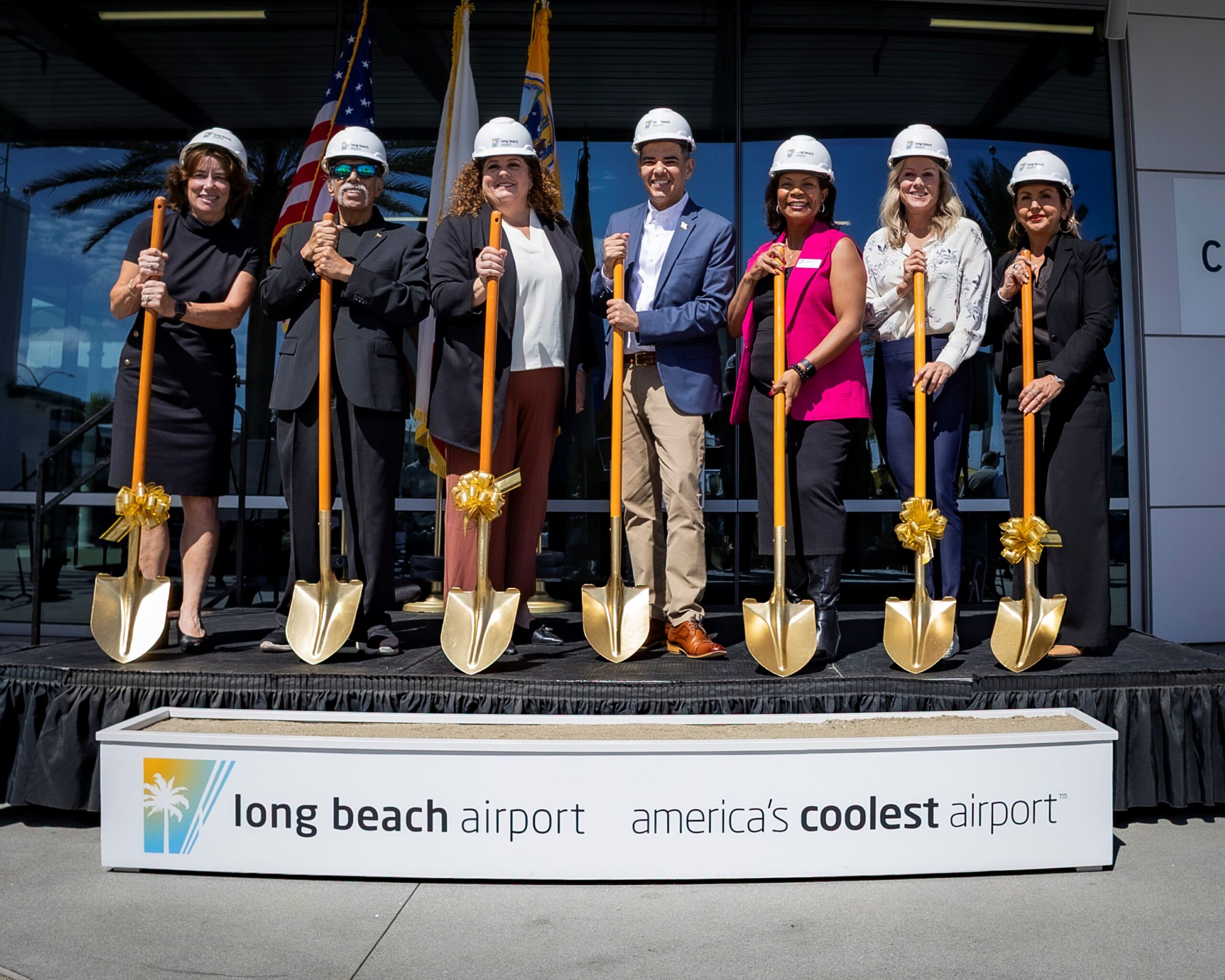 A line of people with golden shovels