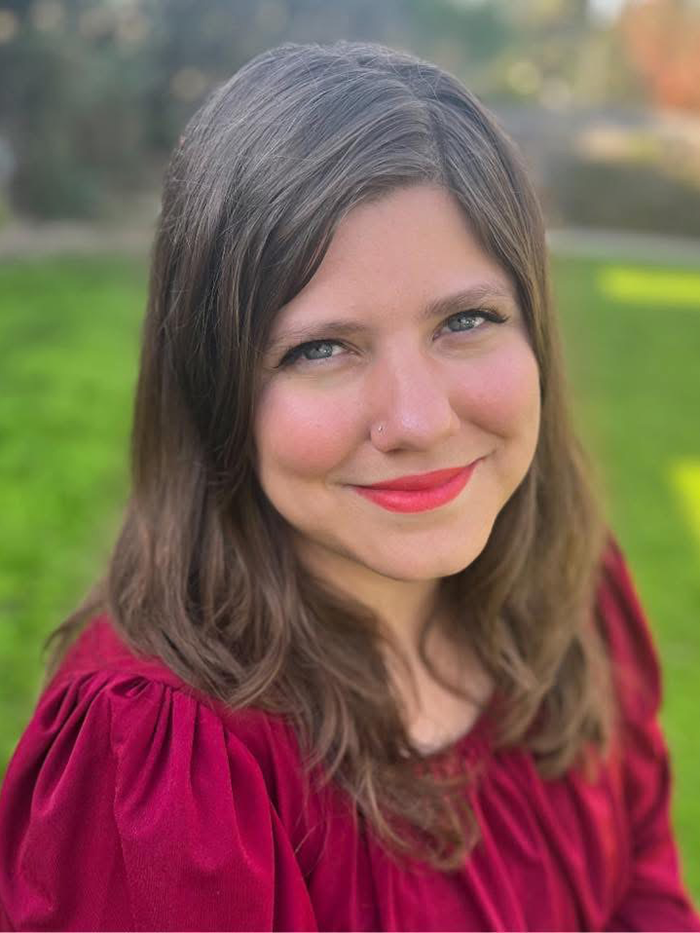 woman wearing a maroon blouse