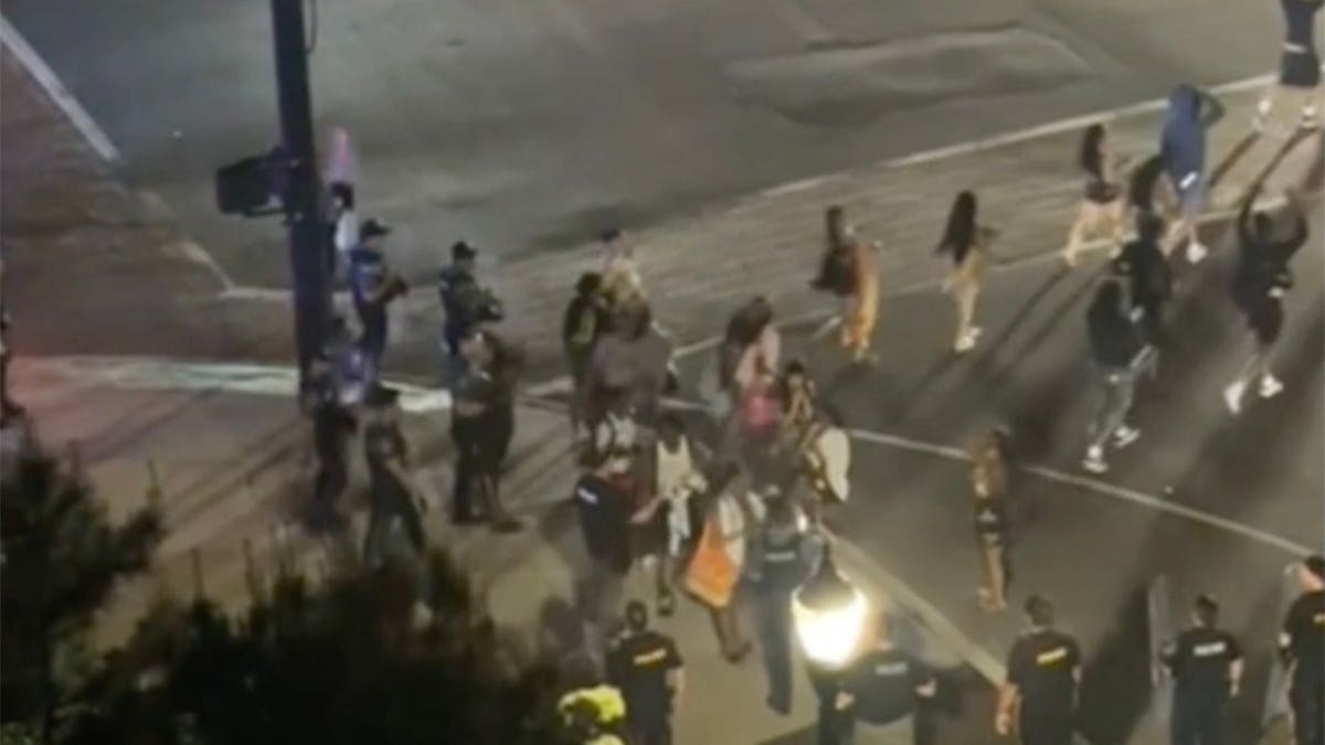 Authorities making arrests during a teen takeover event in Long Branch, New Jersey