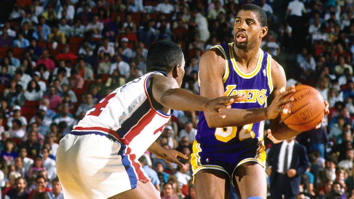 Magic Johnson defending against Joe Dumars during an NBA Finals game at the Silverdome