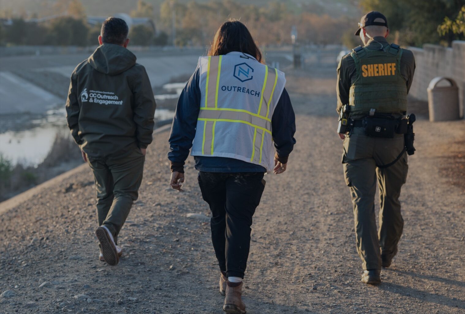 Outreach workers and a sheriff's deputy participate in the 2026 Point in Time Count in Orange County.
