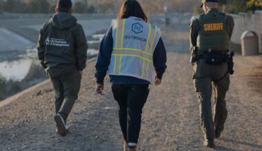 Outreach workers and a sheriff's deputy participate in the 2026 Point in Time Count in Orange County.