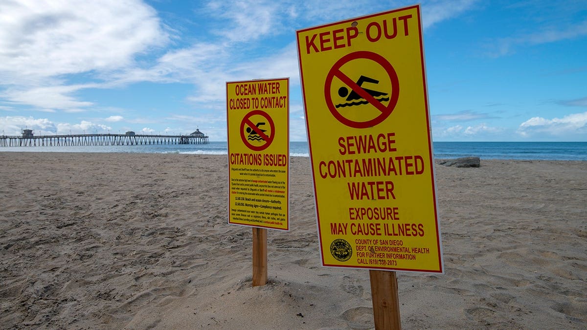 Keep out signs warning of contaminated water in Imperial Beach California