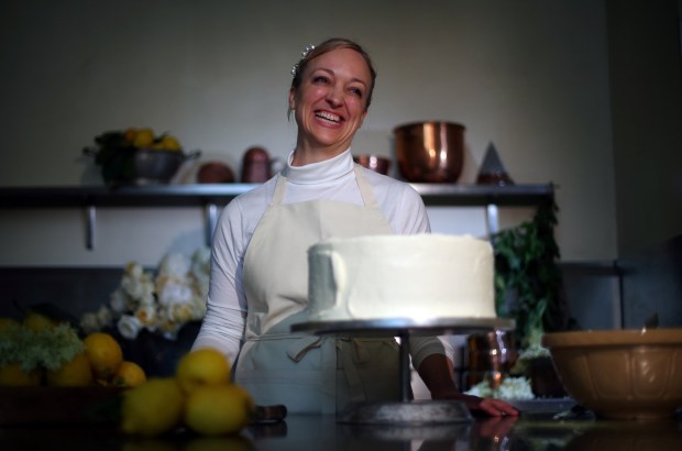 LONDON, ENGLAND - MAY 17: (ONLINE OUT) Claire Ptak, Owner of Violet Bakery in Hackney, east London puts finishing touches on the cake for the Royal Wedding of Prince Harry and Meghan Markle in the kitchens at Buckingham Palace on May 17, 2018 in London England. (Photo by Hannah McKay - WPA Pool /Geetty Images)