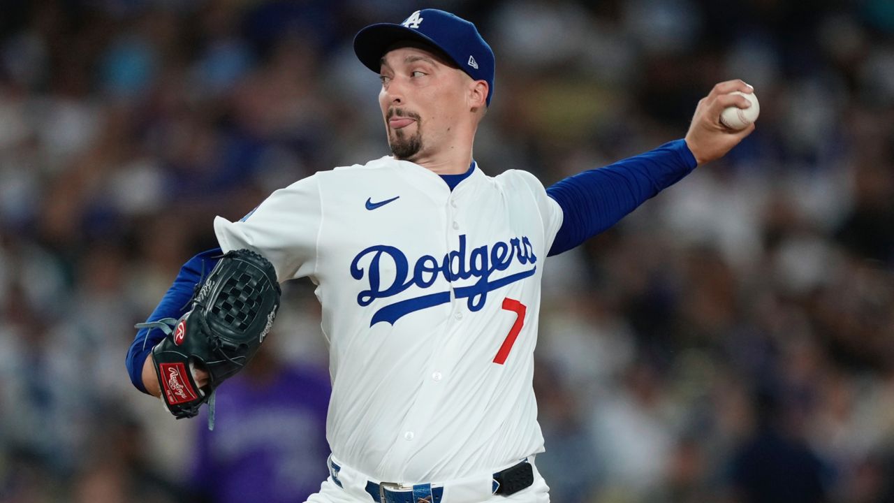 Los Angeles Dodgers starting pitcher Blake Snell throws to the plate during the first inning of a baseball game against the Colorado Rockies, Wednesday in LA. (AP Photo/Mark J. Terrill)