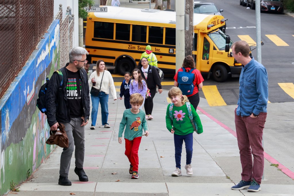 Students, faculty, and parents arrive at Harvey Milk Civil Rights Academy.