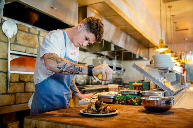 Herb & Sea executive chef Aidan Owens in the Encinitas restaurant's kitchen. (Alejandro Tamayo / The San Diego Union-Tribune)
