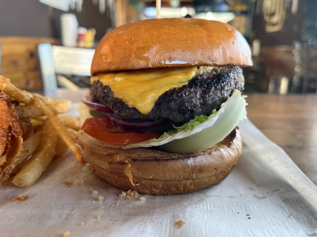 The Signature Burger, with a 6-ounce Angus beef patty and American cheese, at Crazee Burger in North Park. (Pam Kragen / The San Diego Union-Tribune)