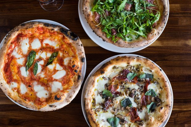 A trio of wood-fired pizzas from Isola Pizza Bar, which will open its third location in Encinitas this spring. (Isola Pizza Bar)