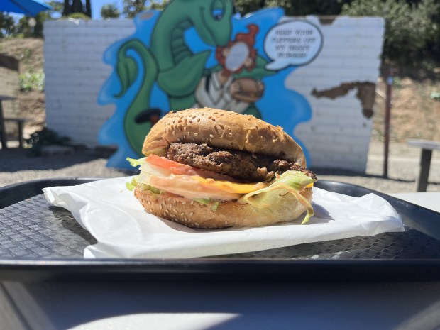 The Original Nessy Burger from Messy Burgers in Fallbrook includes a half-pound beef patty on a toasted 5-inch bun with fresh onions, tomatoes, lettuce and house sauce. (Pam Kragen / The San Diego Union-Tribune)