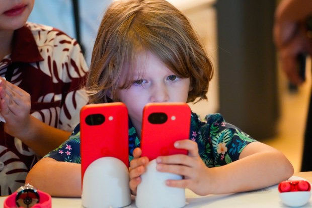 Xander S. gave the game apps open Pixel phone a rundown during the grand opening of the Google Store. San Diego's first Google Store opened on Thursday, May 7, 2026, at Fashion Valley Mall in San Diego, CA. (Nelvin C. Cepeda / The San Diego Union-Tribune)