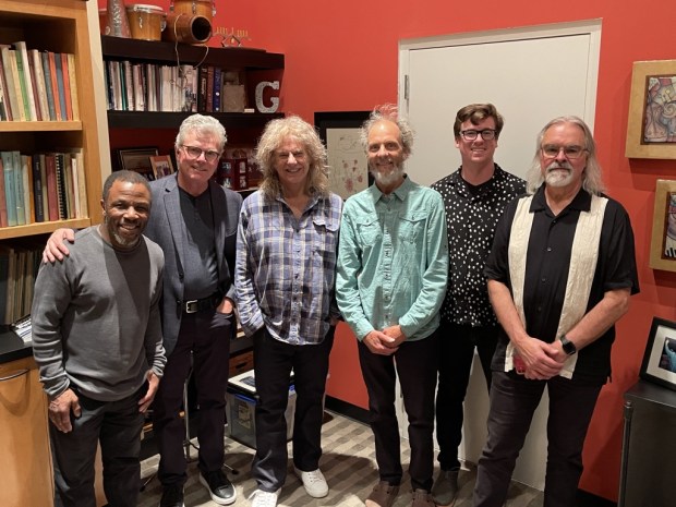 San Diego's Leonard Patton, left, and Peter Sprague, fourth from left, first performed with Pat Metheny, third from left, in 2022 at a private concert in Orange County that featured Metheny accompanied by Sprague's band. Patton this year became a member of Metheny's Side-Eye+ band, which is on an extended world concert tour. (John Opferkuch / Courtesy Peter Sprague)