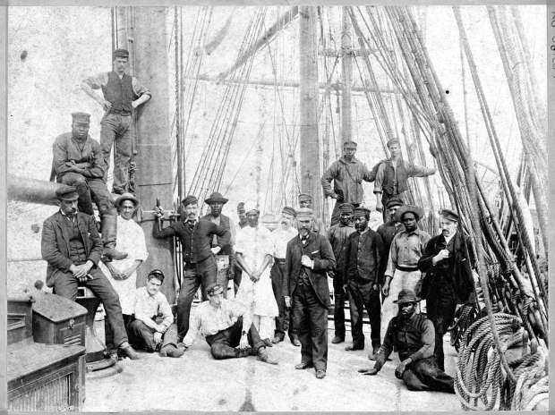 Black and white sailors pose for a photo aboard The Rathburn, a late 19th-century British sailing ship, when it docked in San Francisco in 1892. The photograph is featured in the Maritime Museum of San Diego's new exhibition "Take Me to the Water: Histories of the Black Pacific." (Maritime Museum of San Diego)