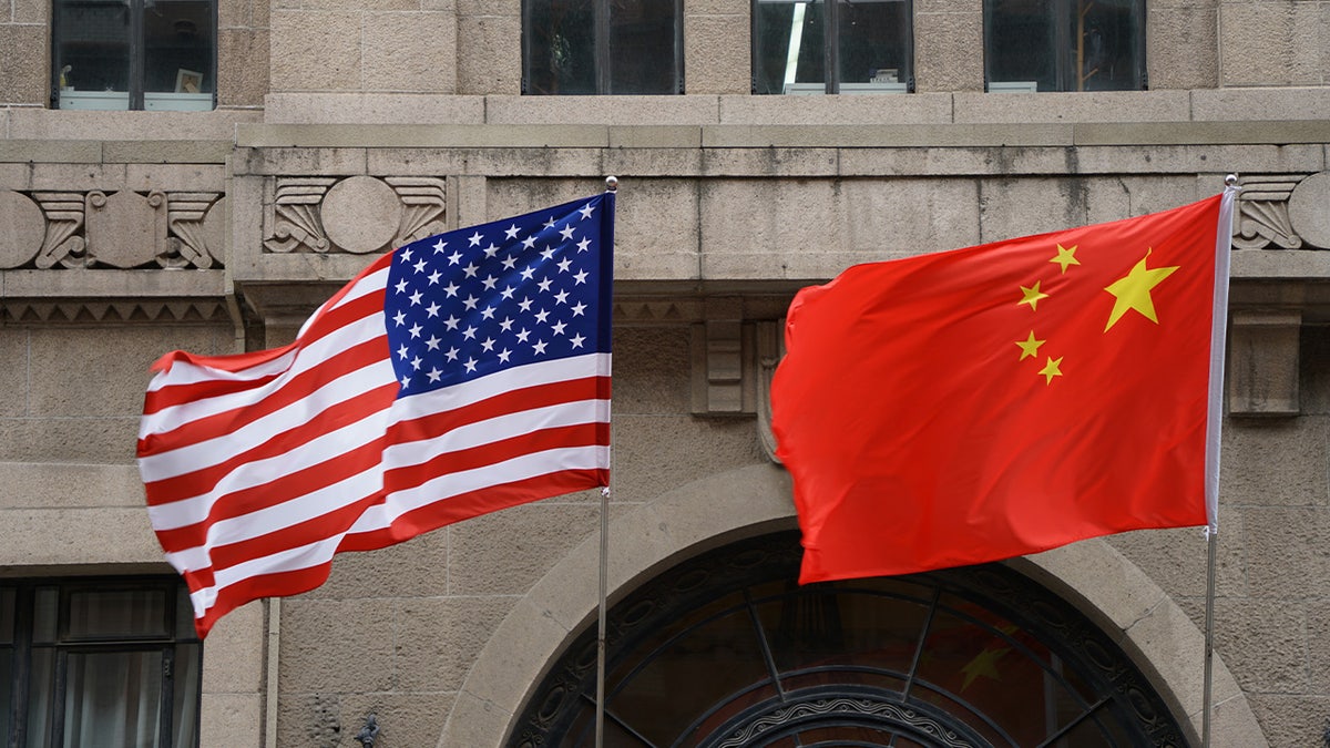 U.S. and Chinese flags displayed side by side.