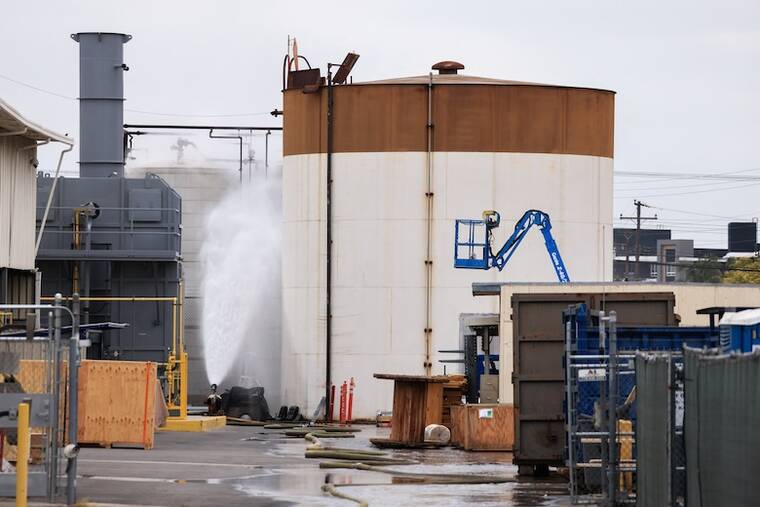 REUTERS/DAVID SWANSON
Water is sprayed during a chemical incident involving a leaking tank of methyl methacrylate, a flammable liquid used in the aerospace industry, forcing an evacuation in the surrounding area, in Garden Grove, Calif., on May 23.