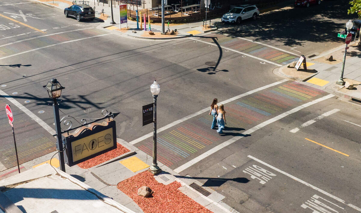 A rainbow crosswalk guides pedestrians across the street last year near Faces at 20th and K streets in the center of the Lavender Heights neighborhood.