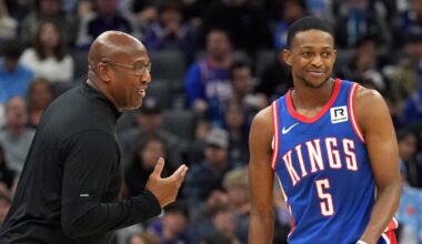 Nov 16, 2024; Sacramento, California, USA; Sacramento Kings head coach Mike Brown (left) talks with guard De'Aaron Fox (5) during the second quarter against the Utah Jazz at Golden 1 Center. Mandatory Credit: Darren Yamashita-Imagn Images