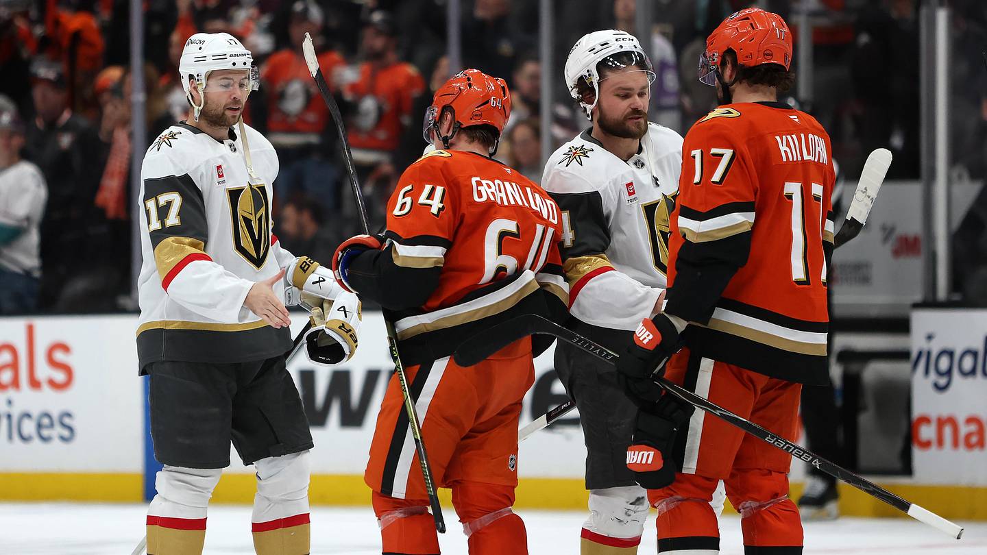 May 14, 2026; Anaheim, California, USA; Vegas Golden Knights defenseman Ben Hutton (17) and defenseman Rasmus Andersson (4) greet Anaheim Ducks center Mikael Granlund (64) and left wing Alex Killorn (17) after game six of the second round of the 2026 Stanley Cup Playoffs at Honda Center. Mandatory Credit: Kiyoshi Mio-Imagn Images