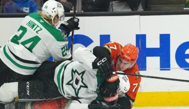 Dec 19, 2025; Anaheim, California, USA; Anaheim Ducks right wing Frank Vatrano (77) grapples with Dallas Stars left wing Jason Robertson (21) and center Roope Hintz (24) in the third period at Honda Center. Mandatory Credit: Kirby Lee-Imagn Images