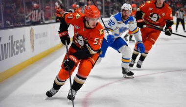 Apr 3, 2026; Anaheim, California, USA; Anaheim Ducks defenseman Olen Zellweger (51) moves the puck against St. Louis Blues left wing Jonathan Drouin (92) during the first period at Honda Center. Mandatory Credit: Gary A. Vasquez-Imagn Images
