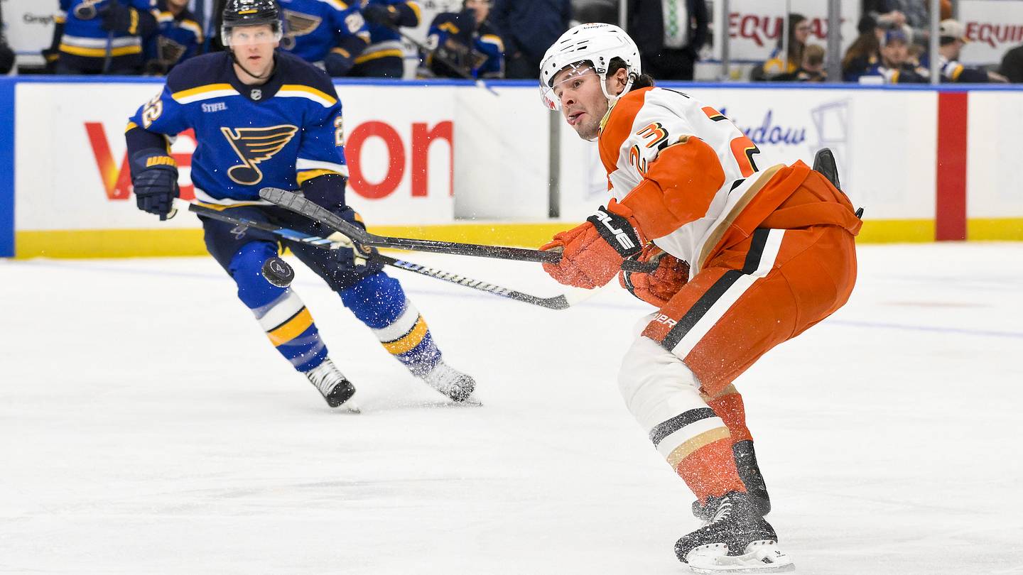 Mar 16, 2025; St. Louis, Missouri, USA;  Anaheim Ducks center Mason McTavish (23) controls the puck against the St. Louis Blues during the first period at Enterprise Center. Mandatory Credit: Jeff Curry-Imagn Images