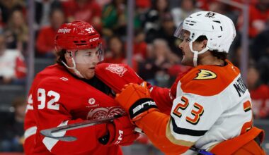 Nov 13, 2025; Detroit, Michigan, USA;  Detroit Red Wings center Marco Kasper (92) and Anaheim Ducks center Mason McTavish (23) shove each other in the first period at Little Caesars Arena. Mandatory Credit: Rick Osentoski-Imagn Images