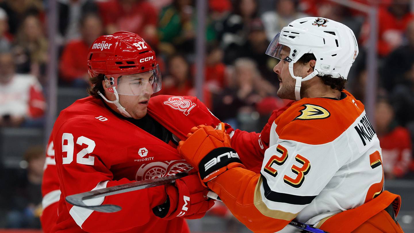 Nov 13, 2025; Detroit, Michigan, USA;  Detroit Red Wings center Marco Kasper (92) and Anaheim Ducks center Mason McTavish (23) shove each other in the first period at Little Caesars Arena. Mandatory Credit: Rick Osentoski-Imagn Images