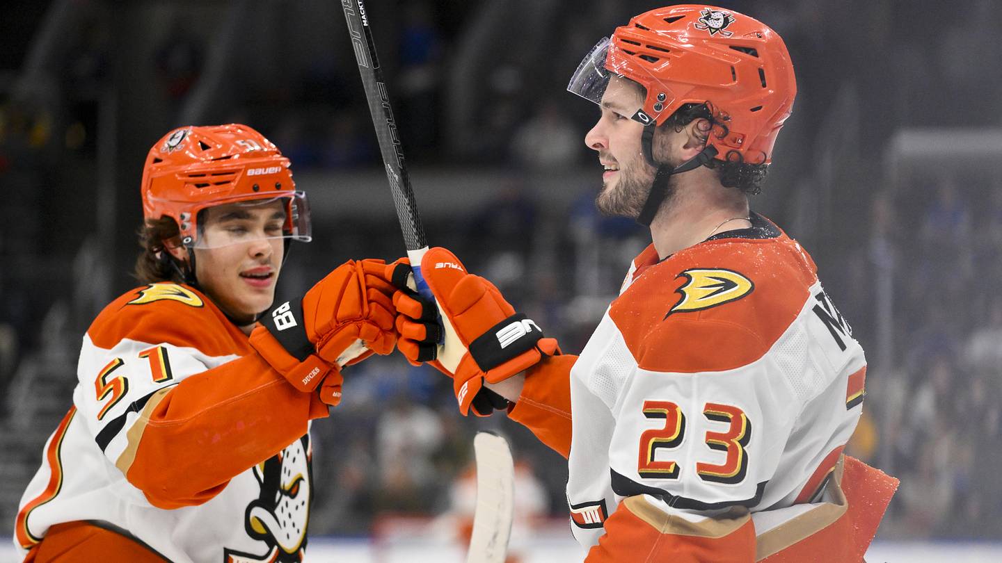 Dec 1, 2025; St. Louis, Missouri, USA; Anaheim Ducks center Mason McTavish (23) is congratulated by defenseman Olen Zellweger (51) after scoring against the St. Louis Blues during the first period at Enterprise Center. Mandatory Credit: Jeff Curry-Imagn Images