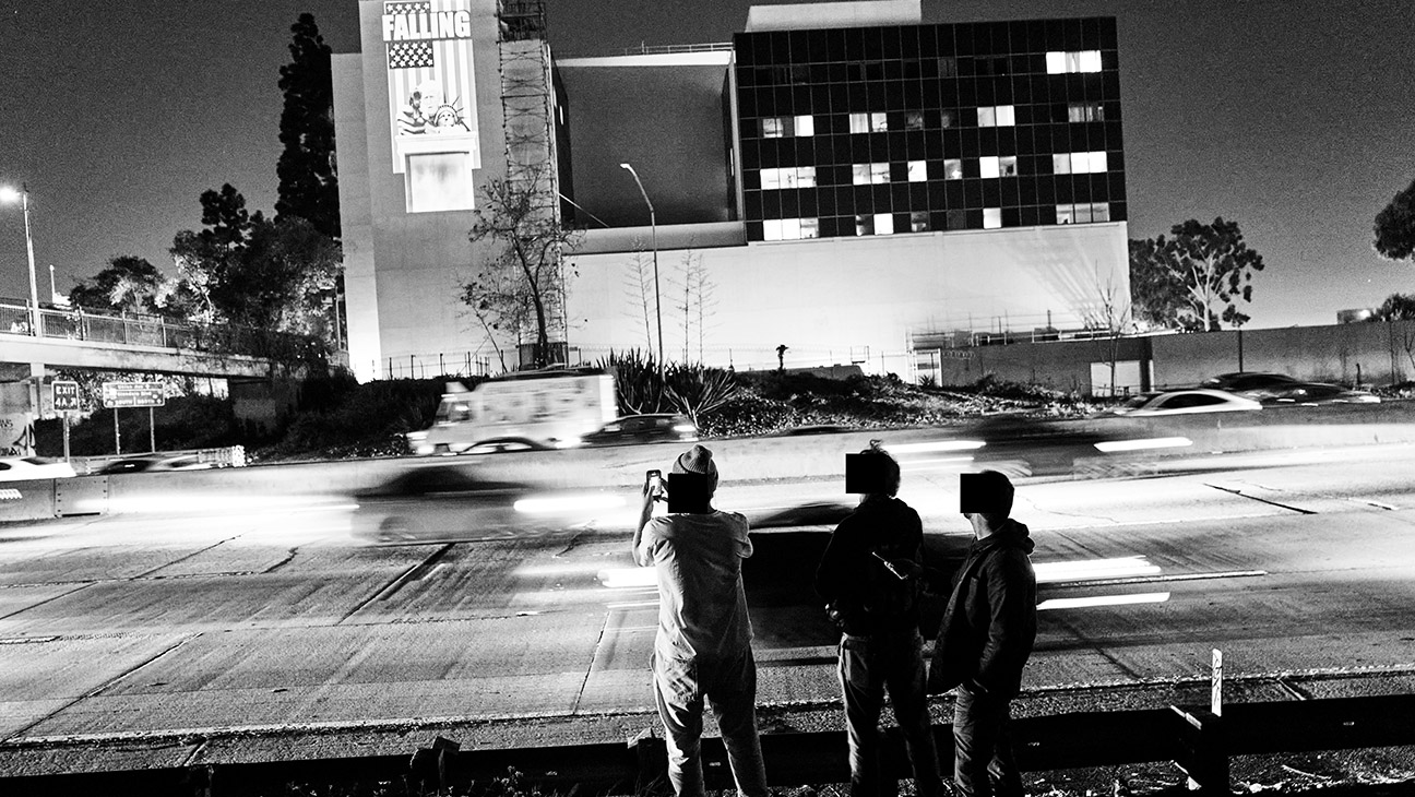 VJayBombs’ satirization of the State of the Union address projected onto the L.A. Downtown Medical Center.