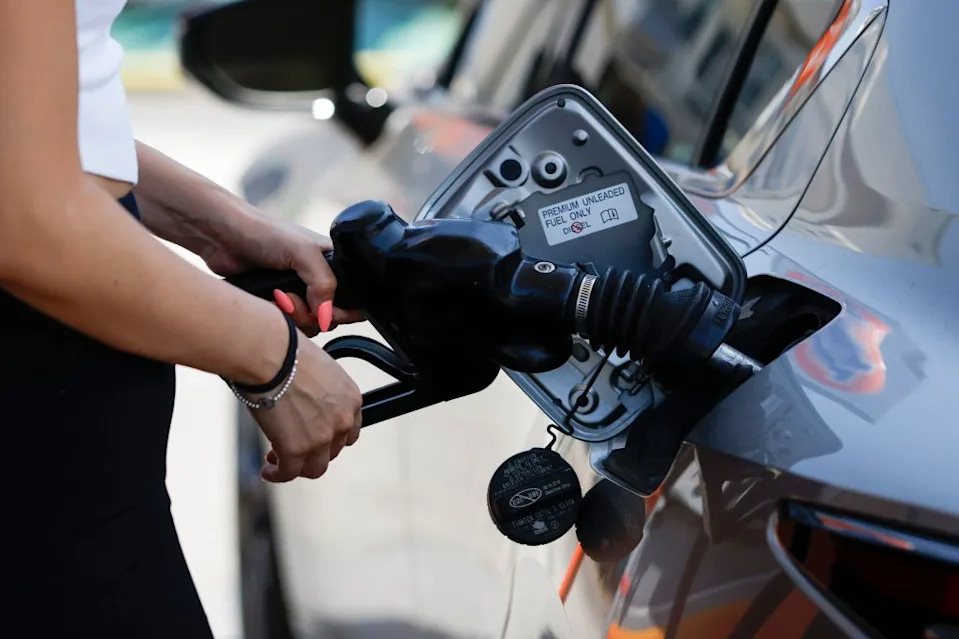 A person pumps gasoline into a car at a 76 gasoline station in Los Angeles. CAROLINE BREHMAN/EPA-EFE/Shutterstock