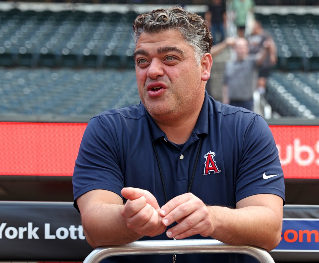 Los Angeles Angels General Manager Perry Minasian in a navy polo with the Angels logo at Citi Field.