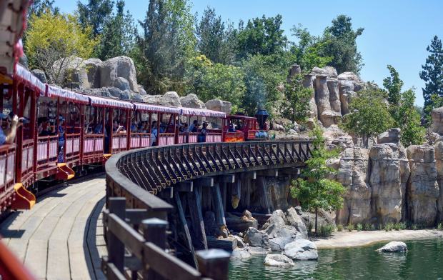 Disneyland railroad engine #1, C.K. Holliday, makes its way over the new trestle bridge that separates Rivers of America from the new Star Wars land named Galaxy's Edge in Anaheim, California, on Friday, July 28, 2017. (Photo by Jeff Gritchen, Orange County Register/SCNG)